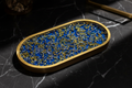 Royal blue resin tray on black marble surface